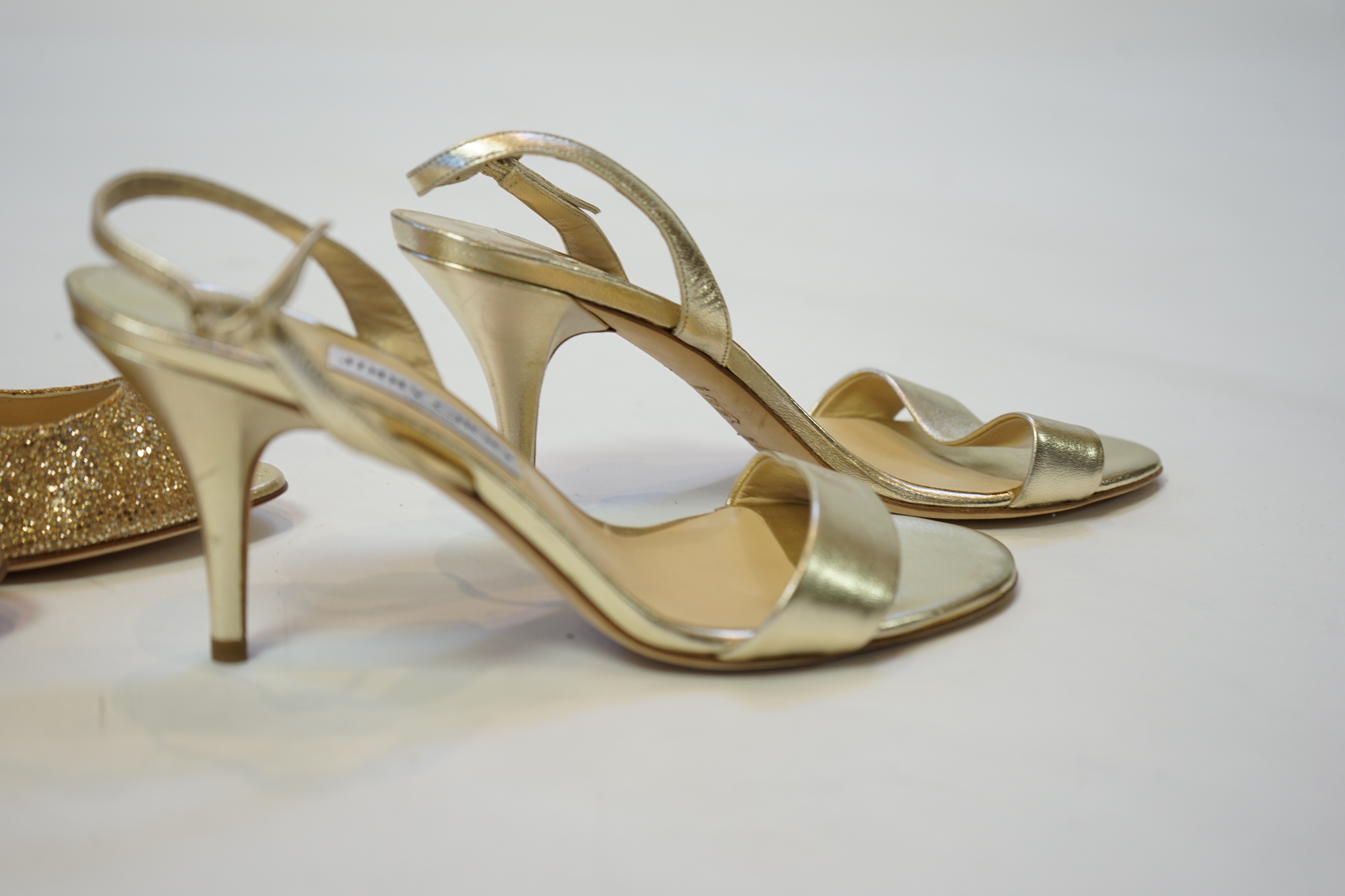 Two pairs of Jimmy Choo gold lady's heeled shoes, size EU 39